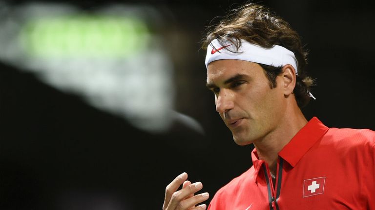 Switzerland's Roger Federer reacts during his Davis Cup match against Kazakhstan's Andrey Golubev