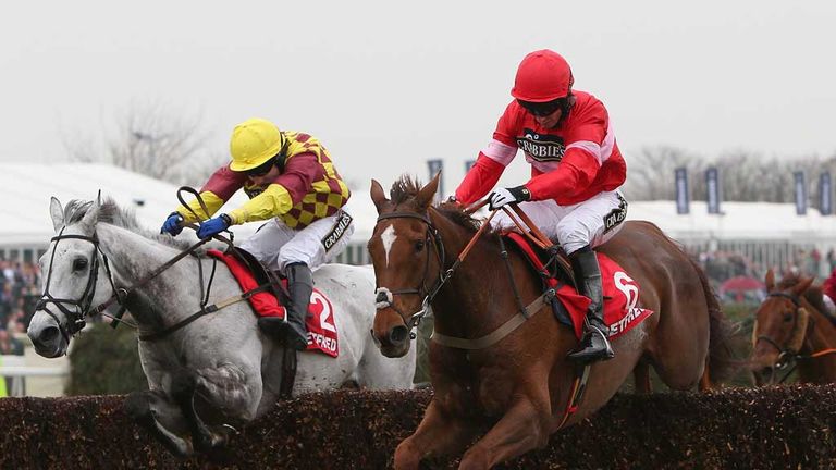 Silviniaco Conti jumps the last just ahead of Dynaste