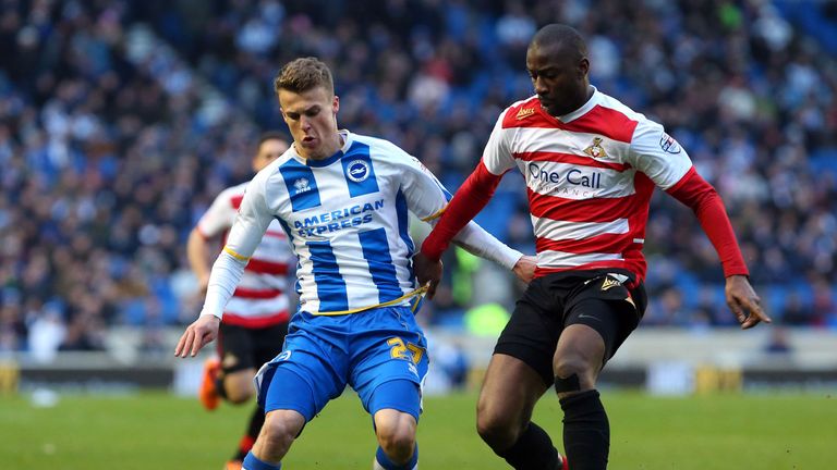 Brighton's Solly March (left) is challenged by Doncaster Rovers's Abdoulaye Meite during the Sky Bet Championship match at the AMEX Stadium, Brighton.