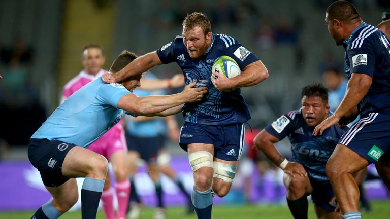 AUCKLAND, NEW ZEALAND - APRIL 25: Luke Braid of the Blues is tackled by Dave Dennis of the Waratahs during the round 11 Super Rugby match between the Blues