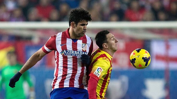 MADRID, SPAIN - JANUARY 11:  Diego Costa (L) of Atletico de Madrid tackles Lionel Messi (R) of FC Barcelona during the La Liga match between Club Atletico 