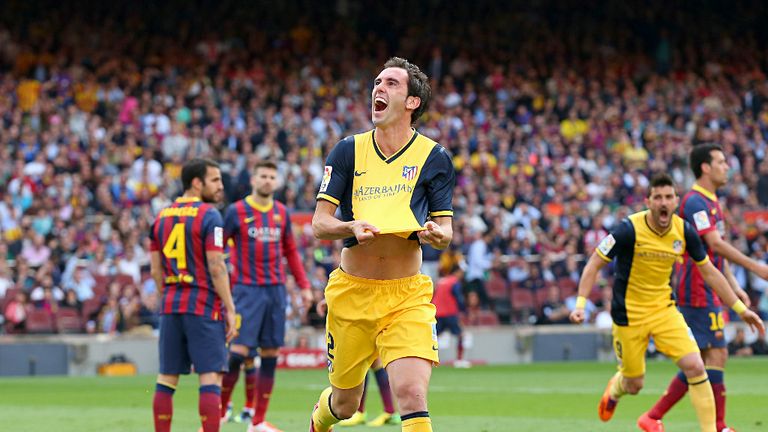 Diego Godin celebrates his title-winning goal at the Nou Camp in 2014