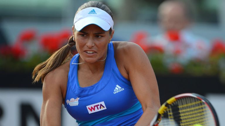 - Monica Puig of Puerto Rico in action against Maria Sharapova of Russia during day 4 of the Internazionali BNL dItalia 2014
