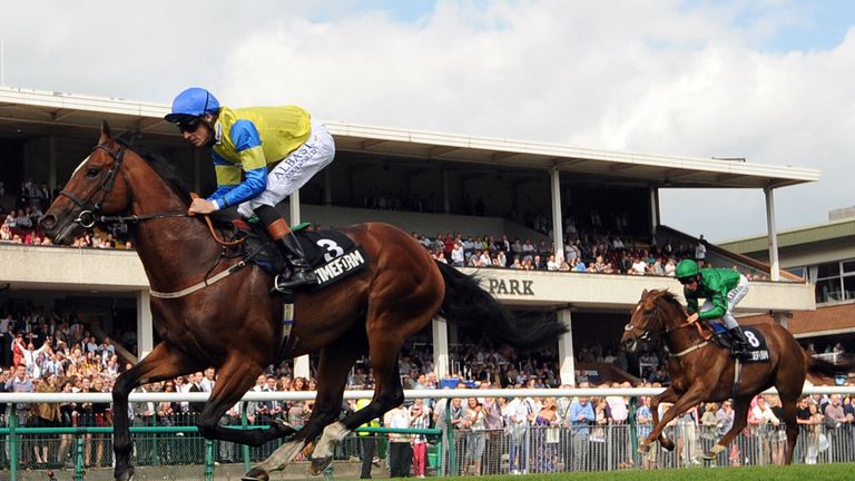 Aeolus ridden by Richard Hughes wins the New Timeform Flags Sandy Lane Stakes from Betimes