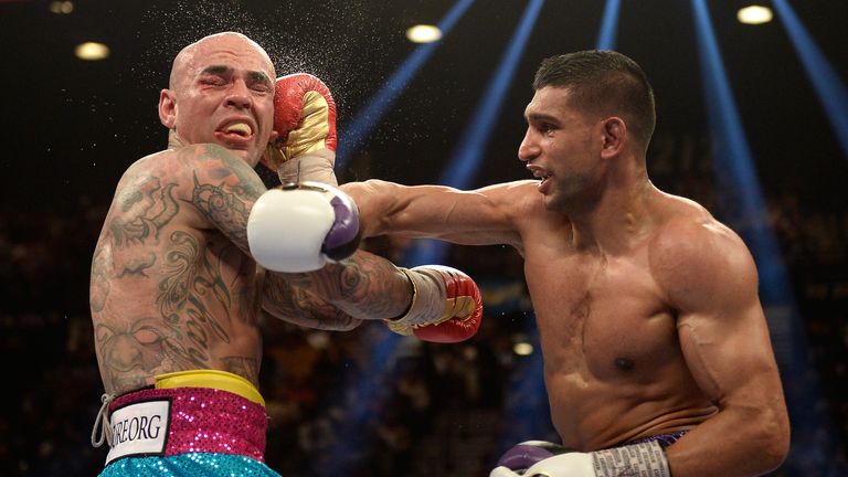 Amir Khan connects with a right hand on Luis Collazo during their welterweight bout at the MGM Grand