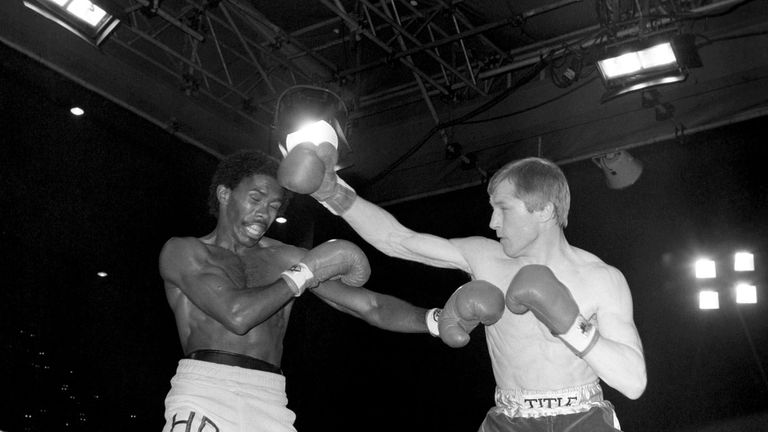 World Lightweight Champion Jim Watt (r) catches challenger Howard Davis Jr (l) with a right to the head