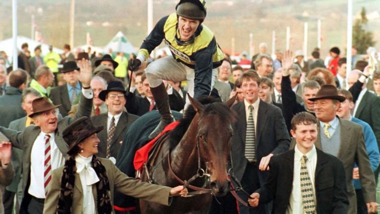 Tony McCoy jumps from Blowing Wind after they had won the Vincent O'Brien County Handicap Hurdle