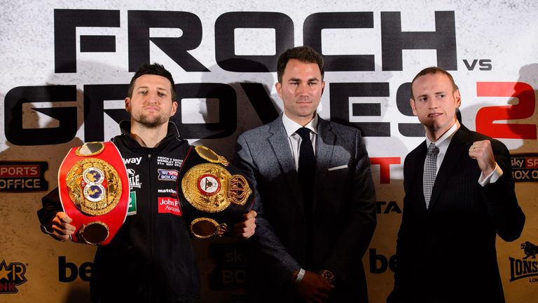 Carl Froch (L) and George Groves (R) stand opposite each other as promoter Eddie Hearn (C) looks on during a press conference at Wembley Stadium