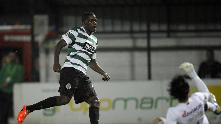 Sporting's midfielder William Carvalho (L) reacts after scoring during the Portuguese league football match FC Pacos de Ferreira vs Sporting CP at the Mata