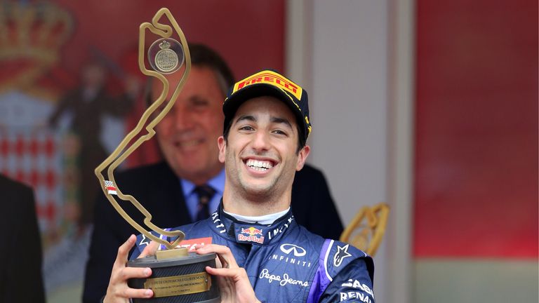 Daniel Ricciardo holds his trophy on the podium