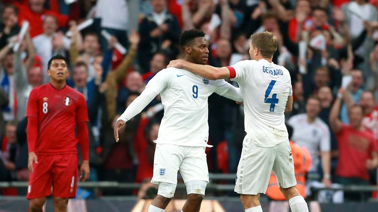 England's Daniel Sturridge celebrates scoring their first goal of the game with team-mate Steven Gerrard (right)