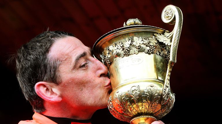 Davy Russell celebrates with the World Series Hurdle cup