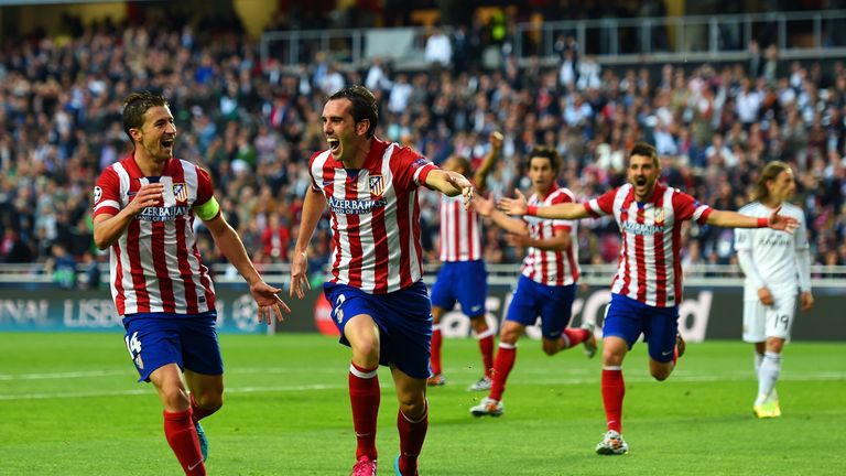 Diego Godin of Atletico Madrid celebrates scoring the opening goal against Real