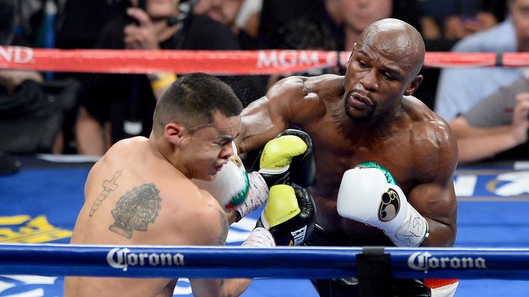 Floyd Mayweather Jr. throws a right at Marcos Maidana during their WBC/WBA welterweight unification fight