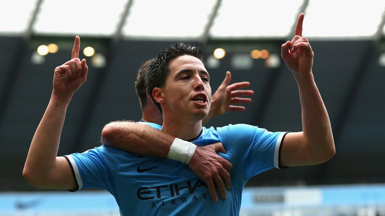 MANCHESTER, ENGLAND - MAY 11:  Samir Nasri of Manchester City celebrates scoring the first goal during the Barclays Premier League match between Manchester