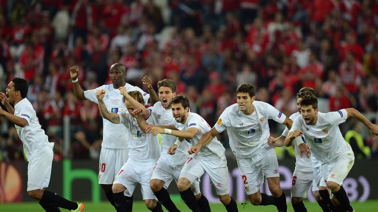 TURIN, ITALY - MAY 14:  Sevilla players celebrate after Kevin Gameiro of Sevilla (not pictured) scores the winning penalty in the shoot out during the UEFA
