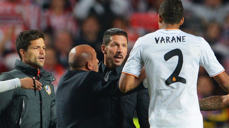 Diego Simeone, Coach of Club Atletico de Madrid (3R) argues with Raphael Varane
