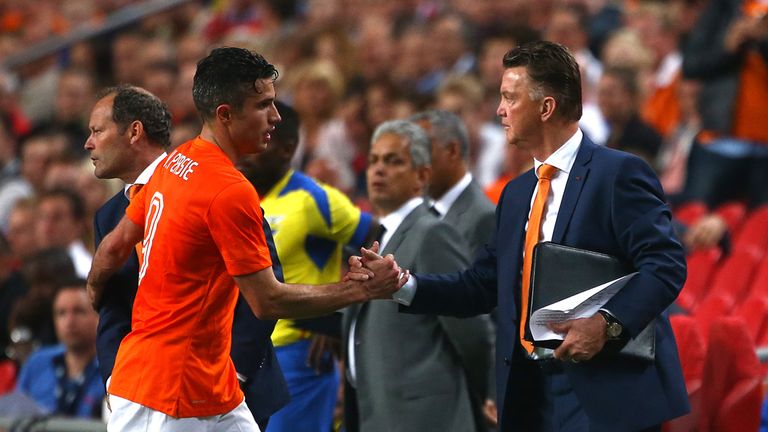 AMSTERDAM, NETHERLANDS - MAY 17: Holland manager Louis van Gaal congratulates Robin van Persie as he is subbed off during the International Friendly match 