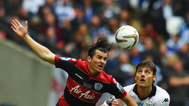 Joey Barton of Queens Park Rangers holds off the challenge of Chris Martin of Derby County