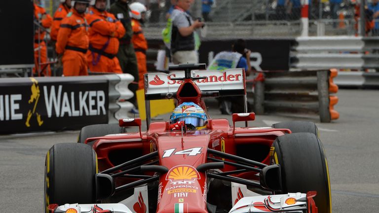 Fernando Alonso attacks the kerbs