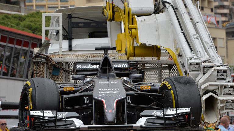 The car of Adrian Sutil is returned to the pits