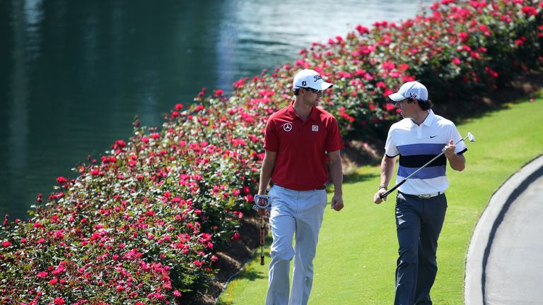Adam Scott of Australia and Rory McIlroy of Northern Ireland walk together during round one of THE PLAYERS Championship