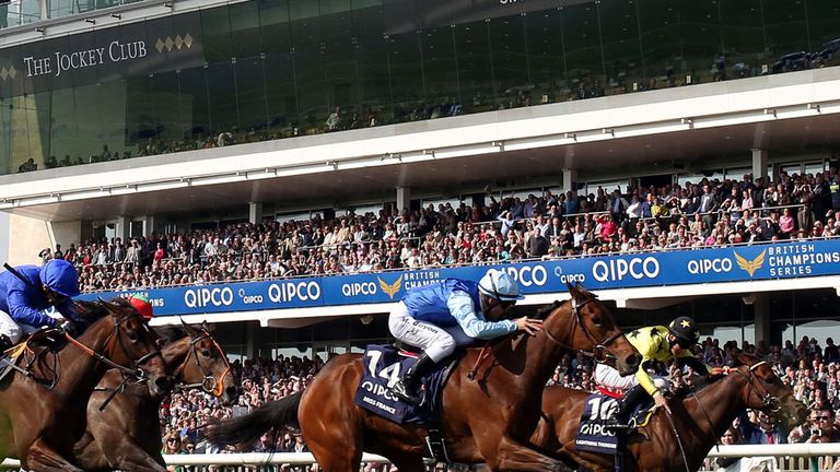 Miss France (centre) ridden by Maxime Guyon celebrates winning the Qipco 1000 Guineas stakes during day two of the 2014 QIPCO Guineas Festival at Newmarket
