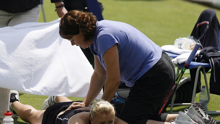 June 15 2008: Elena Baltacha receives treatment for her back against Tsvetana Pironkova during a qualifying match for the International Women's Open