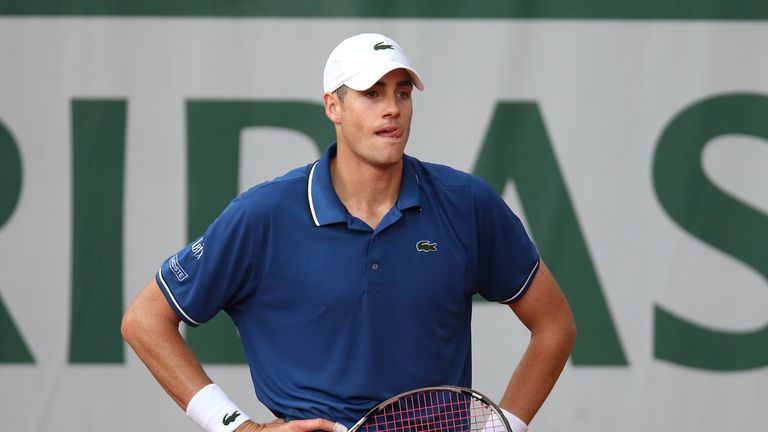 John Isner reacts during his match against Tommy Haas at the 2013 French Open