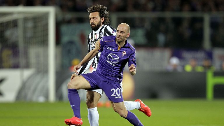 Borja Valero of ACF Fiorentina fights for the ball with Andrea Pirlo of Juventus
