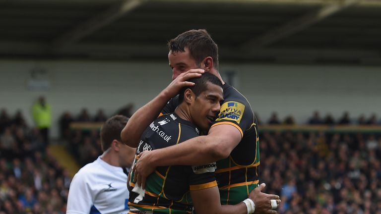 Ken Pisi of Northampton Saints celebrates with team-mate Phil Dowson after scoring during the Aviva Premiership match against London Wasps