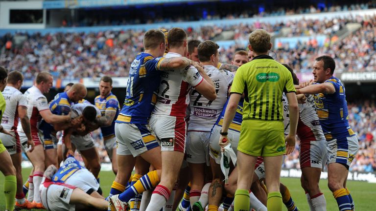 Fighting breaks out between Leeds and Wigan during the First Utility Super League Magic Weekend match at the Etihad Stadium, Manchester.