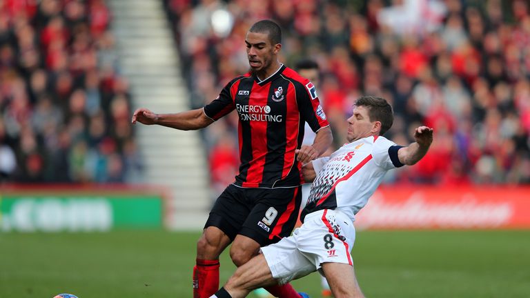 Steven Gerrard of Liverpool tackles Lewis Grabban of Bournemouth during the FA Cup Fourth Round match between Bournemouth
