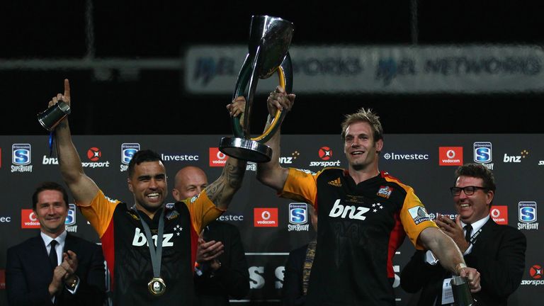 Liam Messam (L) and Craig Clarke of the Chiefs (R) hold the trophy after winning the Super Rugby Final against the Brumbies