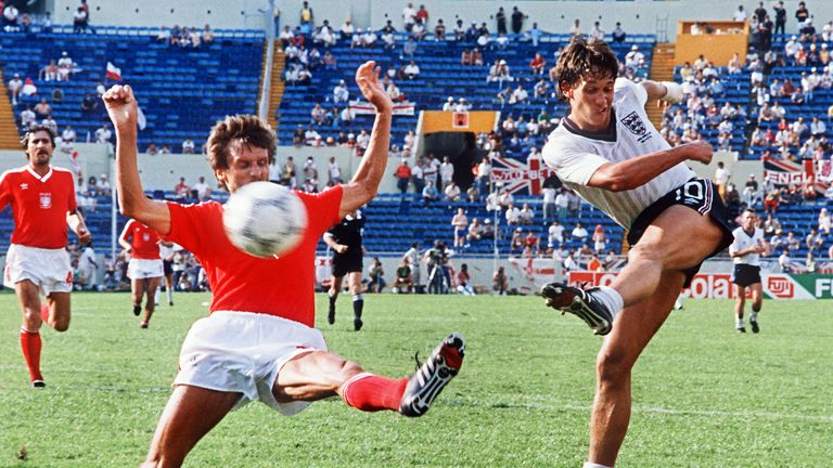 English forward Gary Lineker (R) kicks the ball past Polish defender Stefan Majewski during the World Cup first round soccer match between England and Pola
