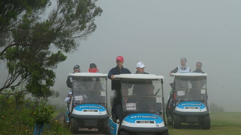 Competitors make their way back to the clubhouse after more fog in Madeira