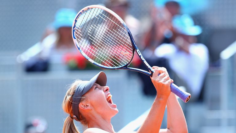 Maria Sharapova of Russia celebrates defeating Agnieszka Radwanska of Poland at the 2014 Madrid Open to reach the final.
