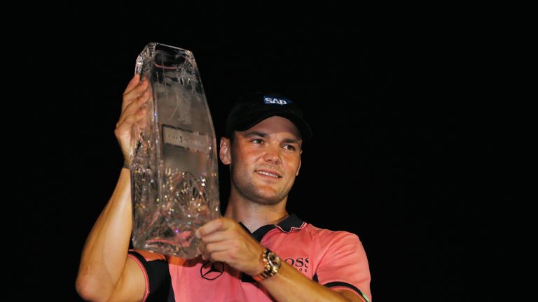 Martin Kaymer of Germany celebrates with the winner's trophy after his one-stroke victory at THE PLAYERS Championship