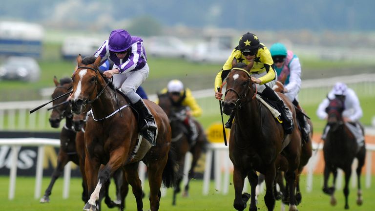 KILDARE, IRELAND - MAY 25:   Ryan Moore riding Marvellous (L) win The Etihad Airways Irish 1,000 Guineas at Curragh racecourse