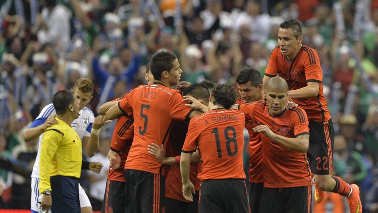 Mexico players celebrate at the Azteca Stadium against Israel
