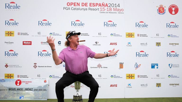 Miguel Angel Jimenez poses with the trophy after winning the Open de Espana at PGA Catalunya