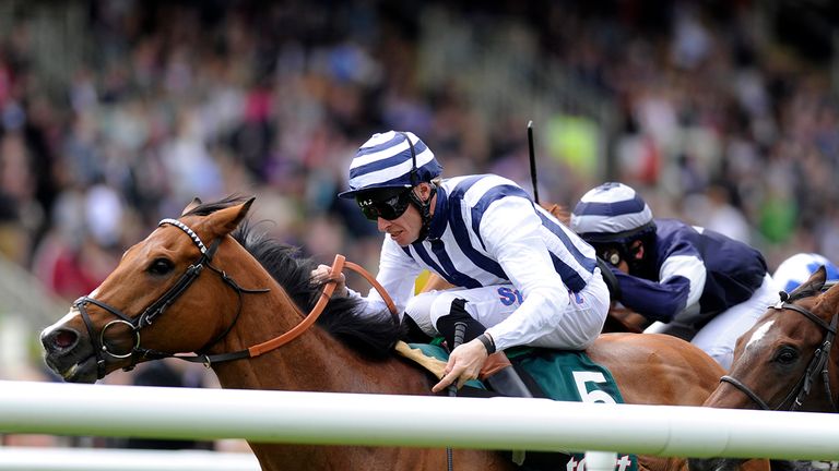 NEWMARKET, ENGLAND - JUNE 09: Richard Hughes riding Mirza win The Fly London Southend To Barcalona Handicap Stakes at Newmarket racecourse on June 09, 2012