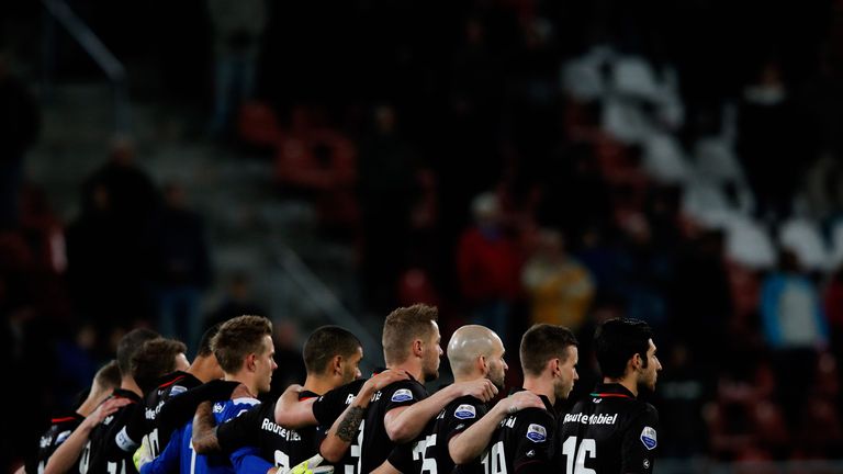 UTRECHT, NETHERLANDS - DECEMBER 06:  The NEC team pay tribute with one minute silence for the passing of Nelson Mandela prior to the Dutch Eredivisie match