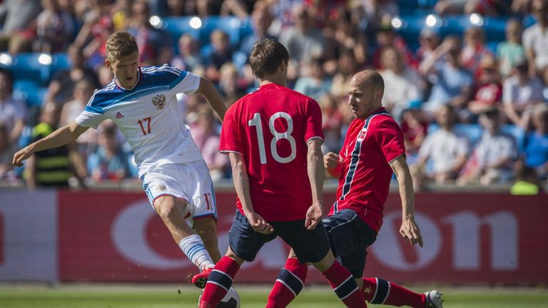 Russia midfielder Oleg Shatov scores the opening goal during a friendly against Norway