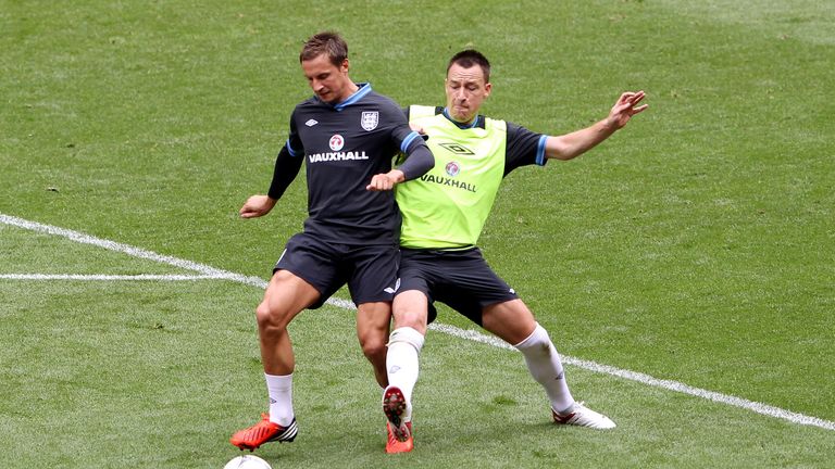 Phil Jagielka is challenged by John Terry during an England training session at Wembley Stadium on June 1, 2012 