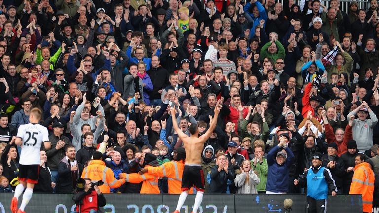 Chris David of Fulham celebrates scoring his late goal with fans during the Barclays Premier League match between Fulham and Crys