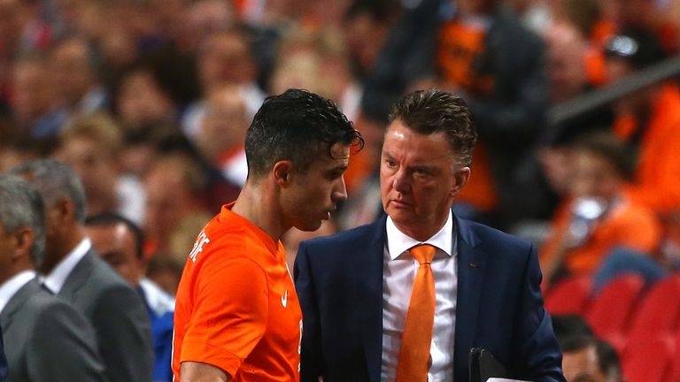 Holland manager Louis van Gaal congratulates Robin van Persie as he is subbed off during the International Friendly match with Ecuador