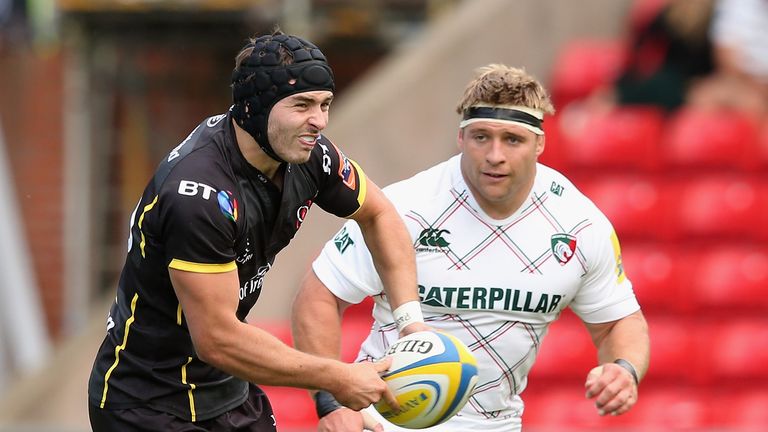 James McKinney passes the ball watched by Tom Youngs during the pre-season match between Leicester Tigers and Ulster. Aug 31 2013.