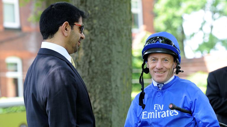 Jockey Kieren Fallon wears the Godolphin blue silks as he talks to trainer Saeed bin Suroor at Haydock