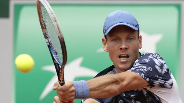 Czech Republic's Tomas Berdych returns to Canada's Peter Polansky during their French tennis Open first round match at the Roland Garros